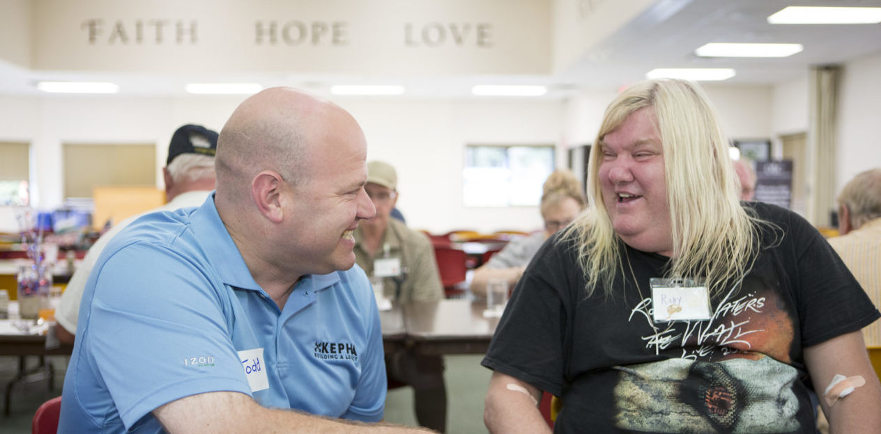 OLC parishioner Todd Oatley visits with a guest