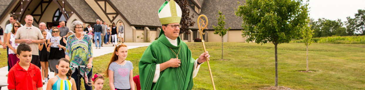 Bishop Walkowiak leads procession following blessing and dedication at St. Sebastian, Byron Center
