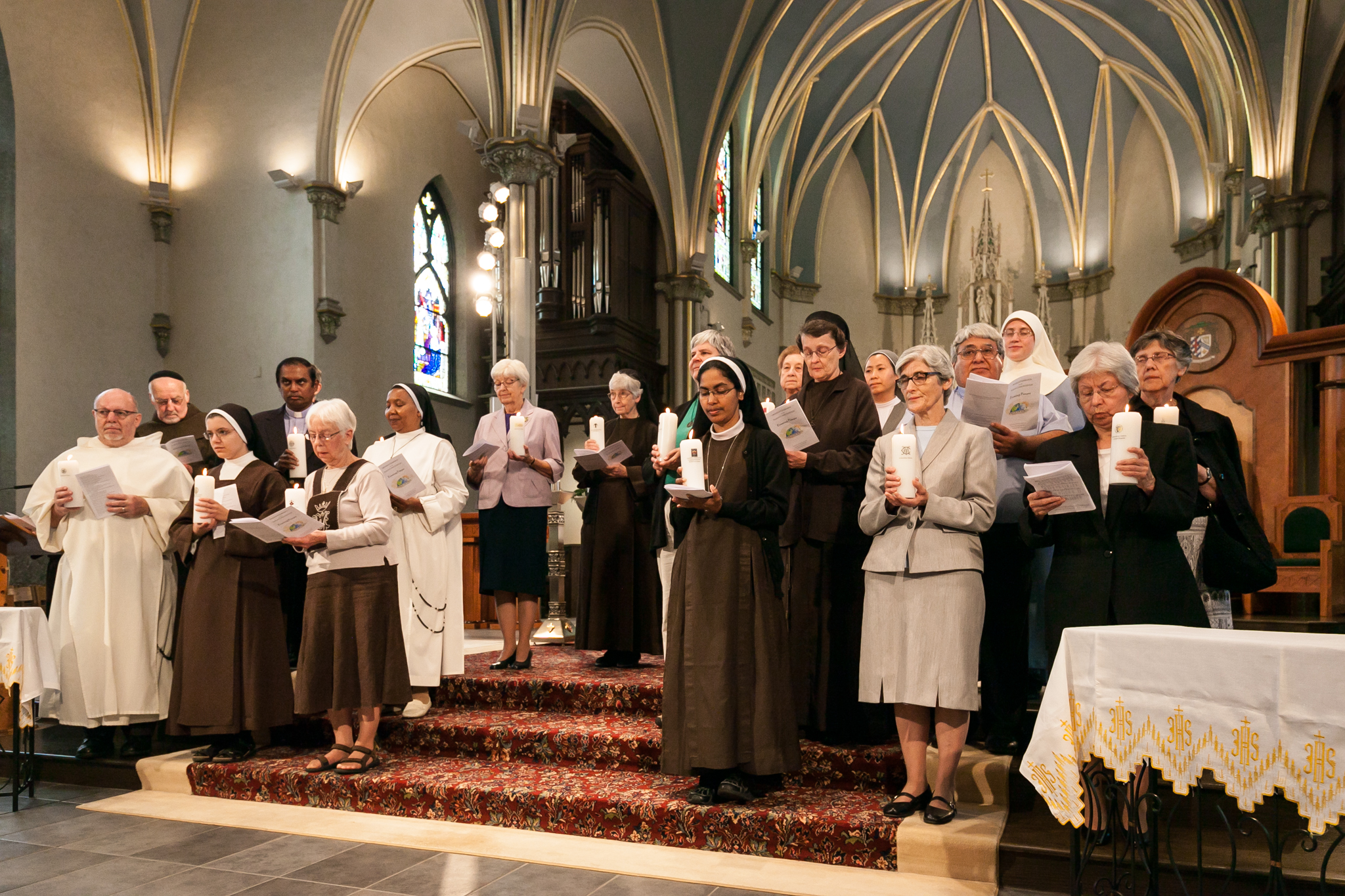 pirests and sisters stand on the altar of the cathedral of saint andrew during a blessing during the mass for consecrated religious life in sept. 2015