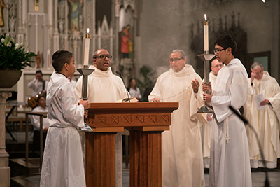 Deacon Gutierrez and Deacon Zapata during Mass at the Cathedral of Saint Andrew.
