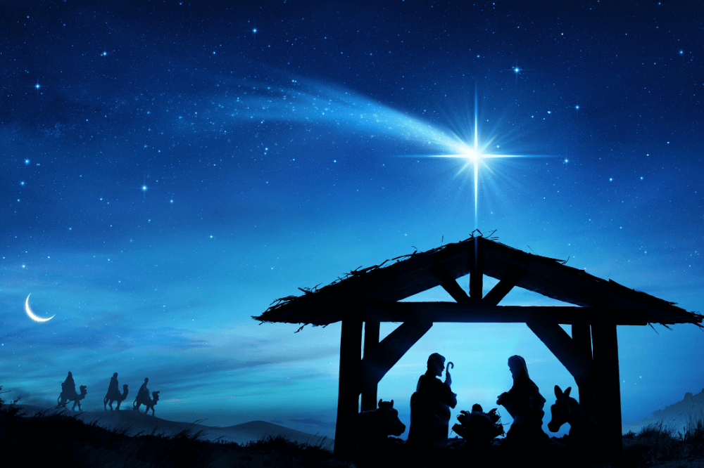 Nativity scene with wise men in the distance