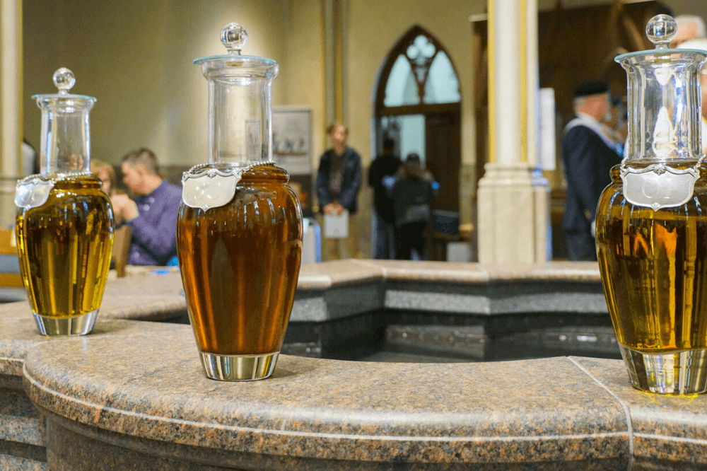 holy oils in jars at chrism Mass, Cathedral of Saint Andrew, 2019 by Eric Tank