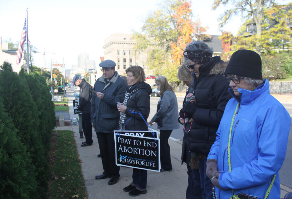 Bishop Walkowiak prays in front of Heritage Clinic during 40 Days for Life October 2016