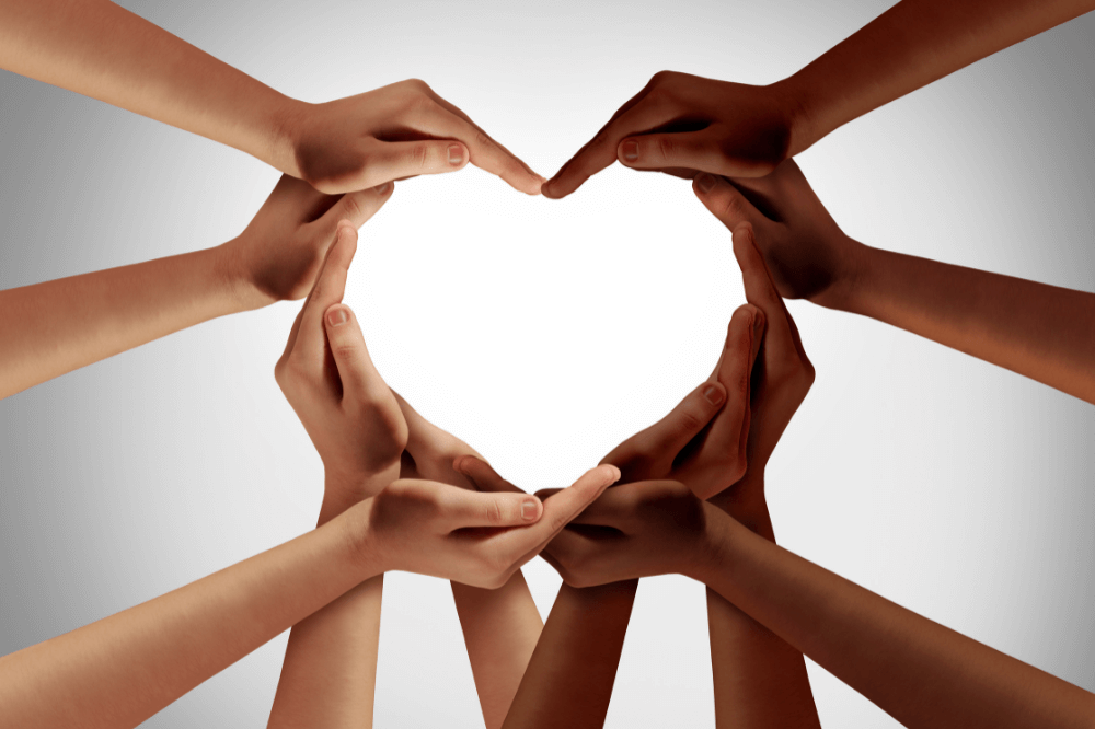 Hands coming together to form a heart