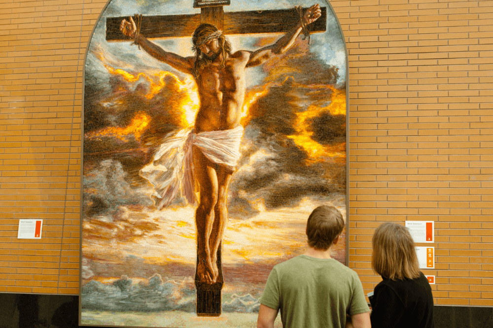 Couple in front of Mia Tavonatti's Crucifixion, ArtPrize 2011 entry