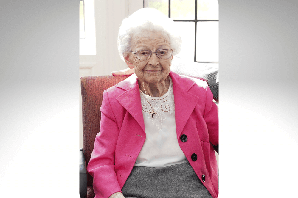 Sister Aquinas Weber, O.P. seated at her 99th birthday party.