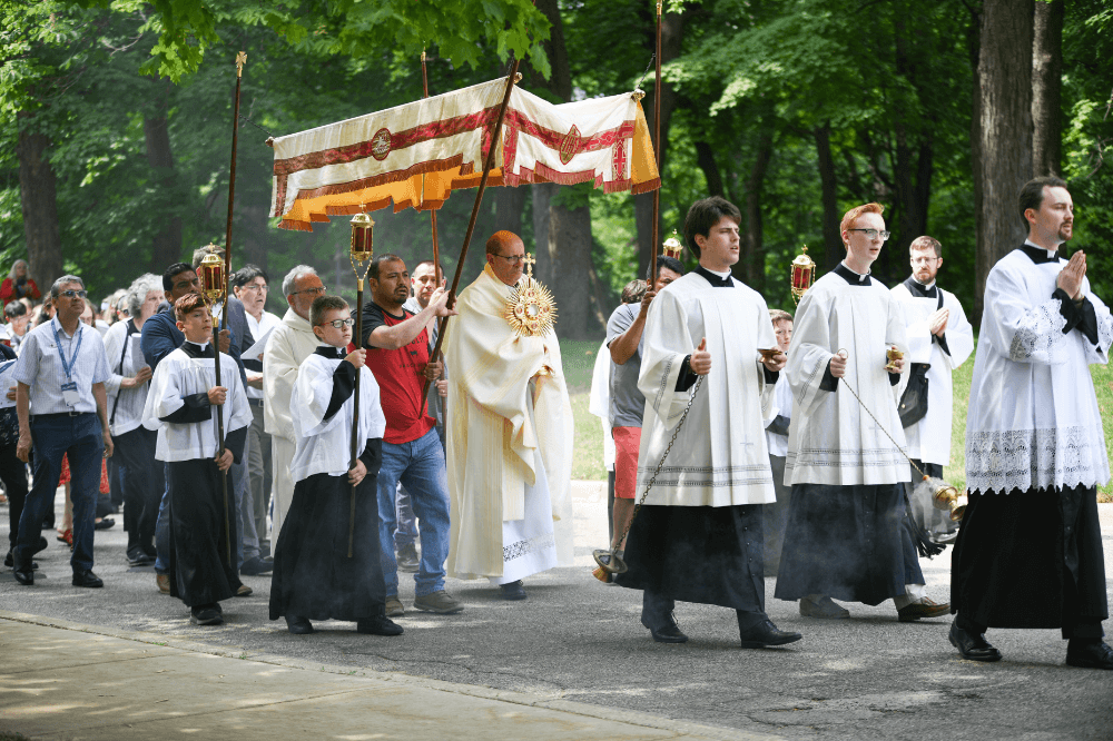 Bishop Walkowiak leads eucharistic procession during Into the Mystery June 10, 2023 on the campus of Aquinas College, by Jaymie Perry
