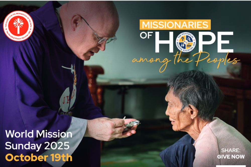 A priest gives a woman the Eucharist in a promotion for World Mission Sunday